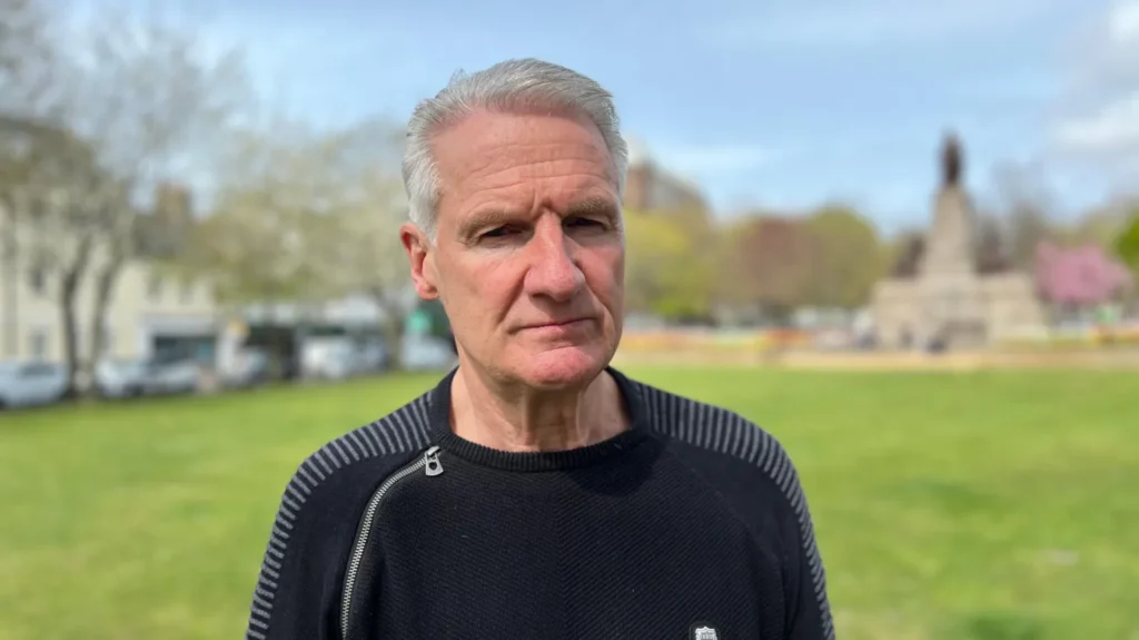 Deputy Tom Binet has rejected 11 out of 20 recommendations from a review of plans for Jersey's new healthcare facilities